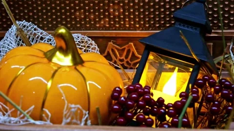 Decorative lantern with candle next to pumpkin. Autumn interior decoration 스톡 동영상 253863848