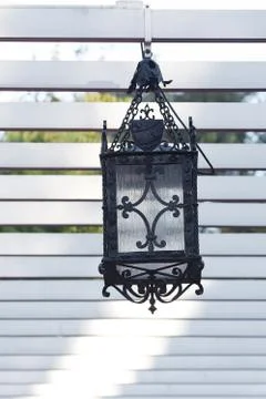 Decorative lantern hanging in the arbor Stock Photos