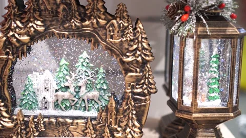 Decorative lanterns with festive winter figures and whirlwinds of snow inside on Stock Footage 256140733