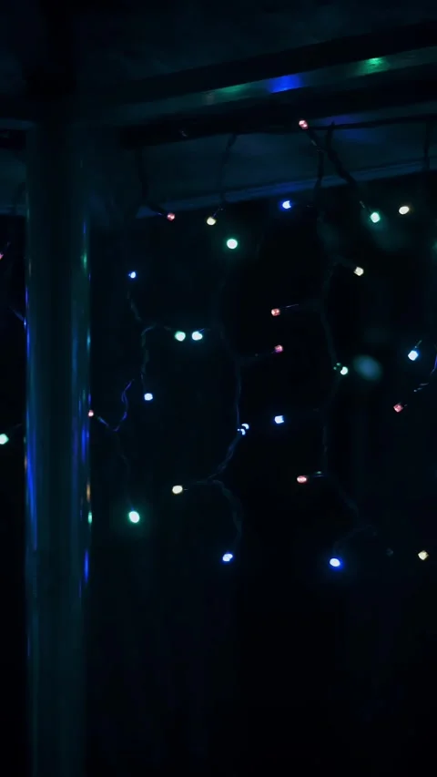 Decorative LED light garland. close-up. beautiful multicolored outdoor garland Stock Footage 319780274