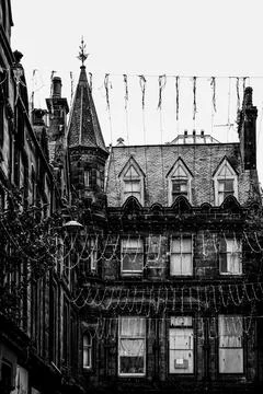 Decorative light strings adorn medieval architecture in Inveness, Scotland Photos