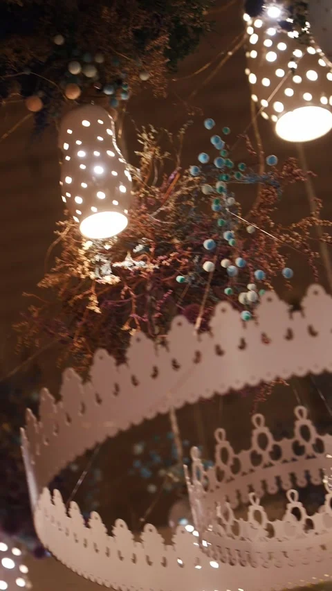 Decorative lighting setup with hanging elements in a festive space Stock Footage 328578216