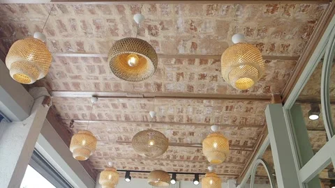 Decorative lights hang from the ceiling in a cafe interior Stock Footage 346015740