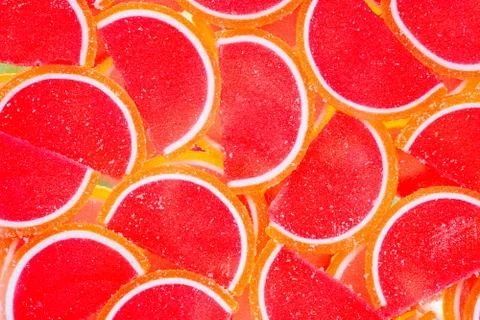 Decorative marmalade candy Background. Pattern of marmalade in shape of citru Stock Photos
