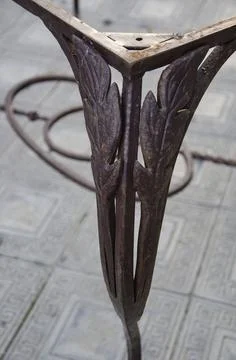 Decorative metal elements on the legs of the table Stock Photos