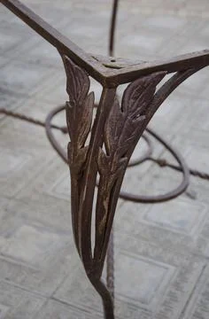 Decorative metal elements on the legs of the table Stock Photos