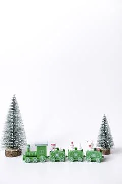 Decorative mini christmas tree and train isolated on white background Stock Photos
