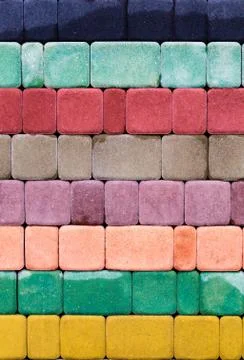 Decorative multi colored tile for the sidewalk from natural stone Stock Photos