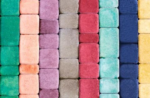 Decorative multi colored tile for the sidewalk from natural stone Stock Photos