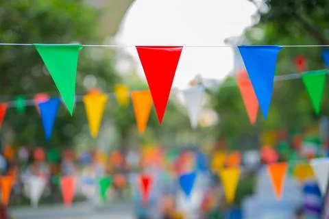 Decorative multi-colored triangle flags against the background Stock Photos