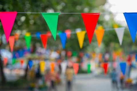Decorative multi-colored triangle flags against the background Stock Photos