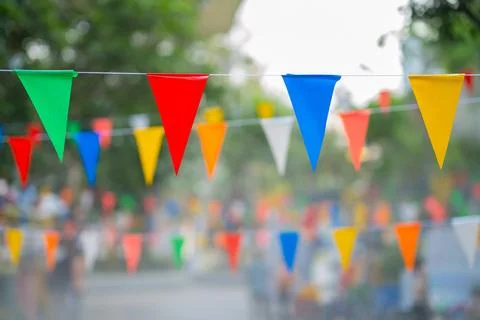 Decorative multi-colored triangle flags against the background Stock Photos