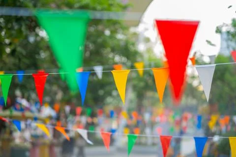 Decorative multi-colored triangle flags against the background Stock Photos