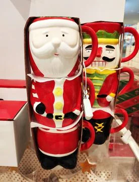 Decorative multicolored ceramic mug in the form of Santa Claus Stock Photos