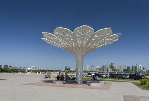 A decorative object in the shape of a flower on the square Stock Photos