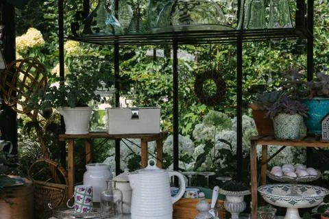 Decorative objects and plants in a veranda Stock Photos