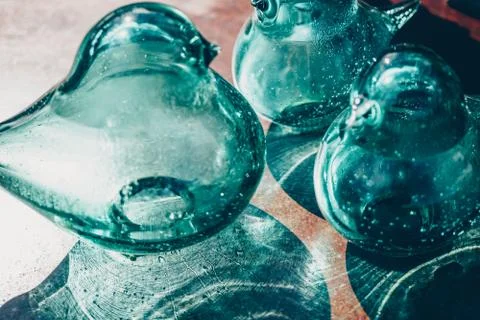 Decorative objects in blown glass on a table outdoor Foto stock