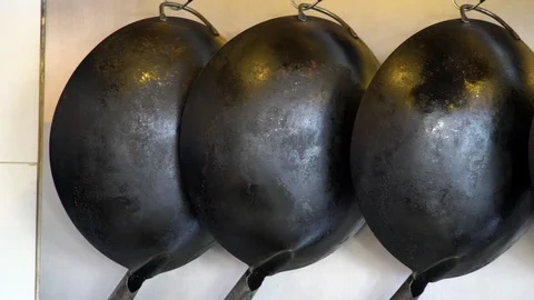 Decorative Old Vintage Empty Frying Pans Hanging on Wall Video stock 92124806