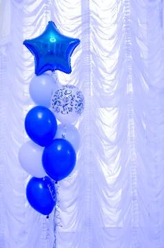 Decorative ornament for the celebration of blue and white balloons on a backg Stock Photos
