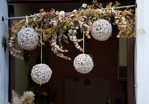 A decorative ornament consisting of homemade balls of yarn suspended from a.. Stock Photos