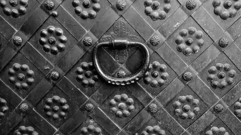 Decorative ornament forged gate elements, closeup forged gate or fence. 写真素材