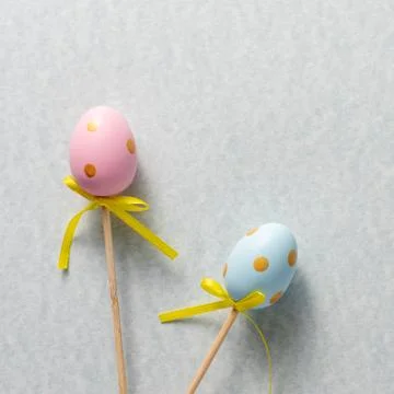 Decorative ornaments in the form of Easter eggs on a gently blue background.  Stock Photos
