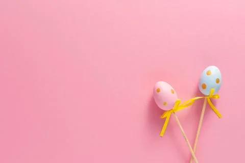 Decorative ornaments in the form of Easter eggs on a pink background. Copy sp Stock Photos
