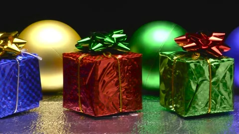 Decorative ornaments in a row. Large multi-colored balls. Gift boxes 動画素材 164792455