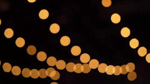 Decorative outdoor string lights hanging in the garden at night or evening time Stock-Footage 95749408