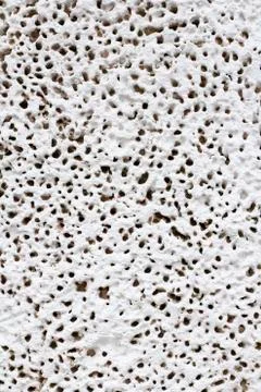 Decorative painted plaster texture, close-up, unique bit pattern. Stock Photos