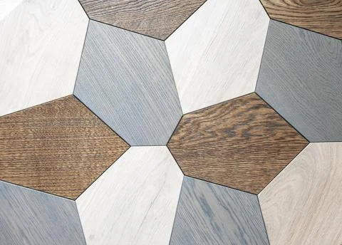 Decorative panel made of wooden multi-colored polygons. Stock Photos