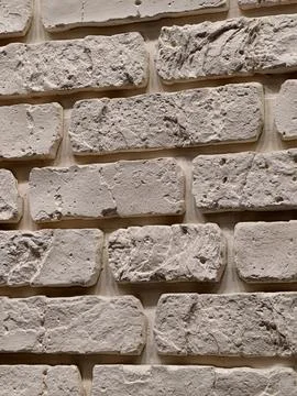 Decorative panels replicating brick stone and tile textures displayed in a .. Stock Photos