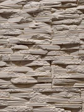 Decorative panels replicating brick stone and tile textures displayed in a .. Stock Photos