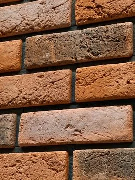 Decorative panels replicating red brick surfaces shown in a retail construc.. Foto stock