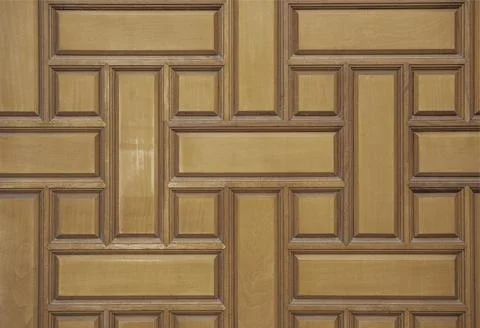 Decorative pattern on the brown wooden surface of the wall as a background Stock Photos