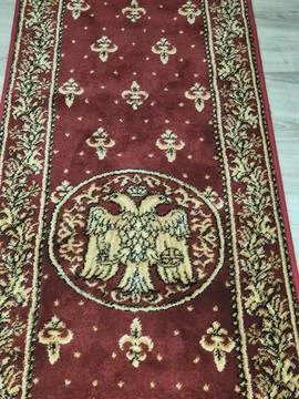 Decorative patterned carpet rug with ornate central medallion 스톡 사진
