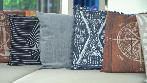 Decorative pillows with colorful patterns on a sofa Stock Photos