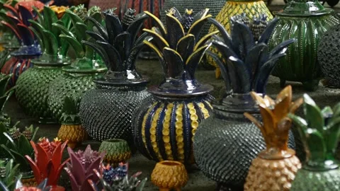 Decorative Pineapple Ornaments With Intricate Patterns at Artisan Market Stall Stock Footage 334649183