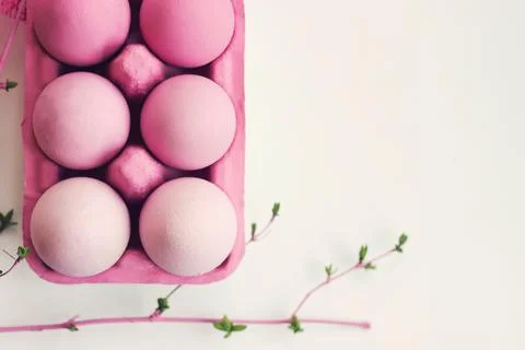 Decorative pink easter eggs in pink box on white background with copy space.. Stock Photos