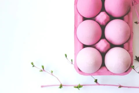 Decorative pink easter eggs in pink box on white background with copy space.. Stock Photos