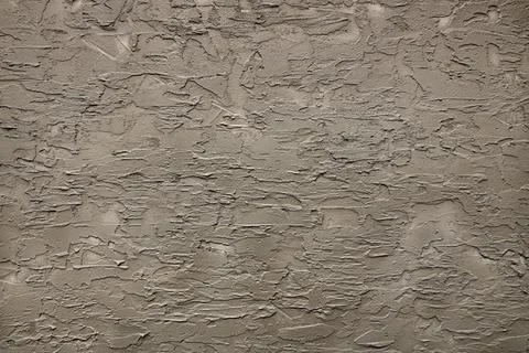 Decorative plaster background. The wall has ridges and uneven surfaces Stock Photos