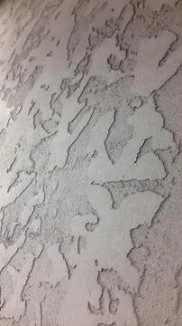 Decorative plaster. Decorative wall plaster. Vintage background. Stock Photos