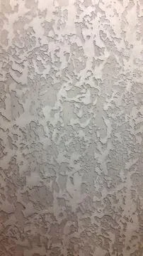 Decorative plaster. Decorative wall plaster. Vintage background. Stock Photos
