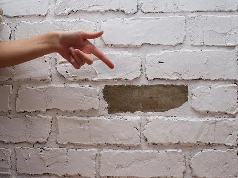 Decorative plaster tile on the wall imitation of brick fell breakdown Stock Photos