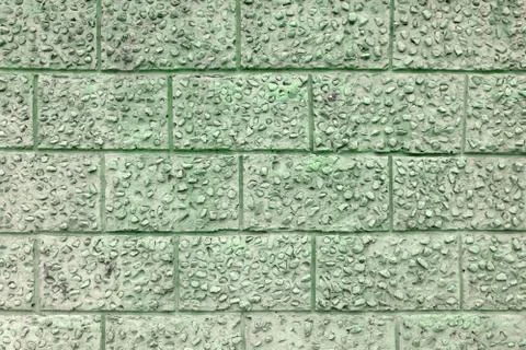 Decorative plaster under a large brick clean, Stock-Fotos