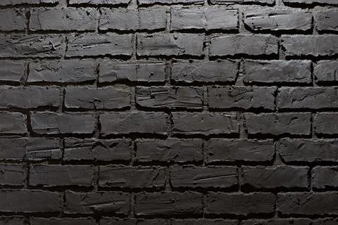Decorative Plaster on the wall in the form of gray brickwork with black style Stock Photos