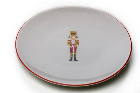 Decorative plate featuring a whimsical nutcracker design for festive occasion Stock Photos