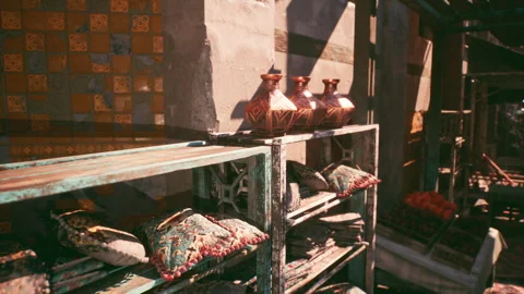 Decorative pottery and textiles displayed in a vibrant marketplace Stock Footage 331422104