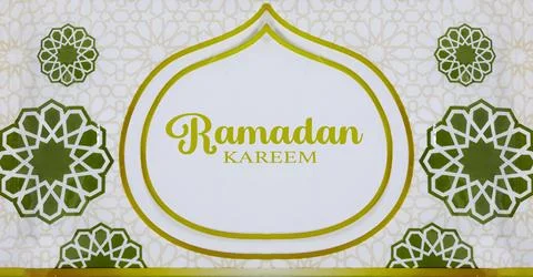 Decorative Ramadan banner featuring the text 'Ramadan Kareem' in gold with green Stock Photos