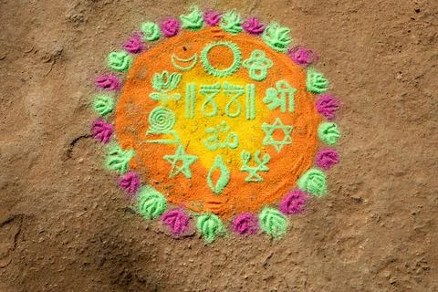 Decorative Rangoli Pattern Created With Colored Powder On Home Entrance Floor Stock Photos